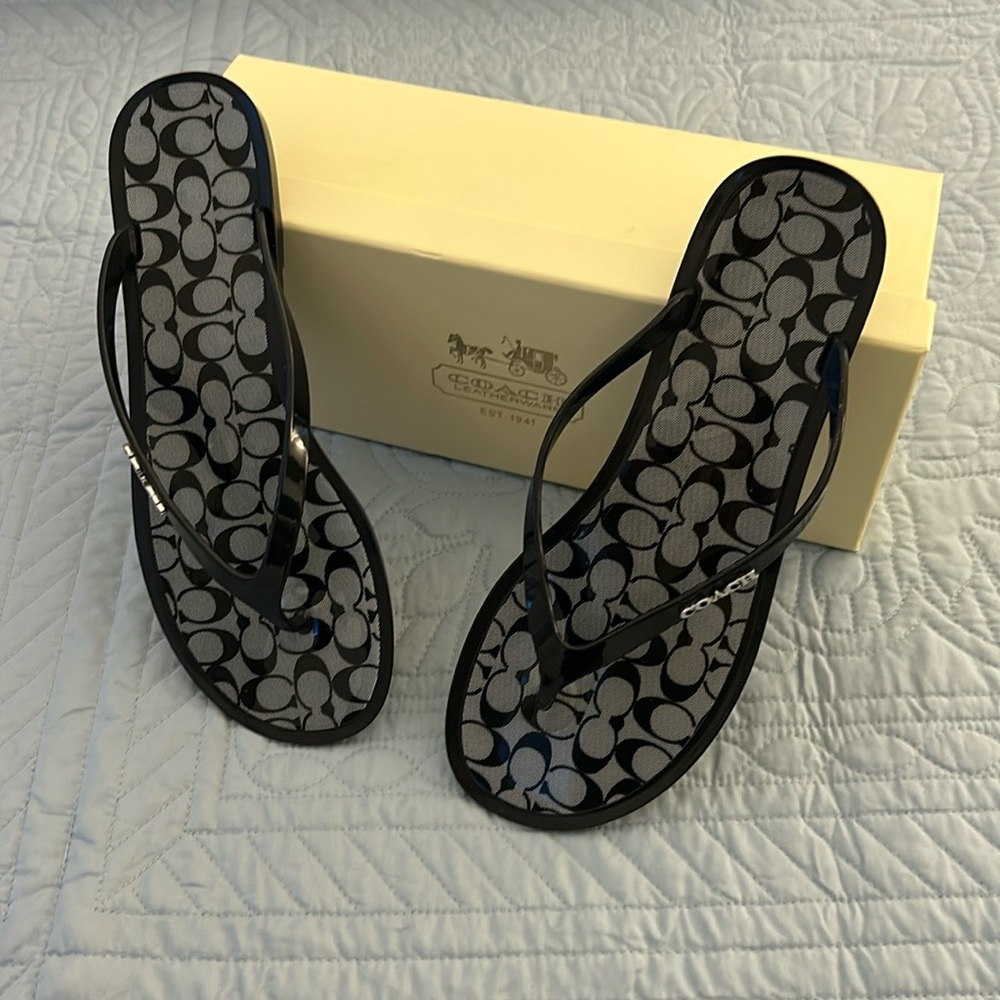 NWOT Coach flip flops. Women’s size 9.